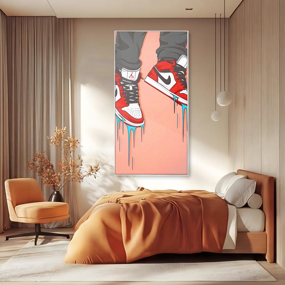 Tablou canvas cu ilustratie digitala cu adidasi rosii, in rama de aluminiu argintiu, pe perete intr-un dormitor